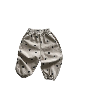 Pantalon sarouel ample pour enfants à pois avec taille élastique et chevilles resserrées