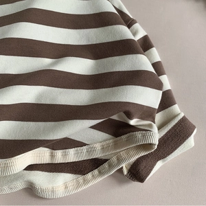 Girl's long sleeve cotton t-shirt with brown and white stripes and ribbed cuff details