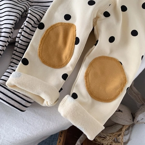 Fleece lined leggings for toddlers featuring cute polka dots and protective knee patches