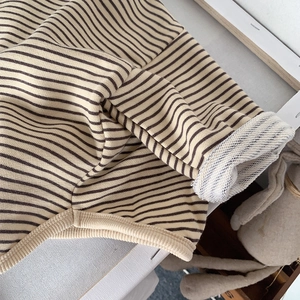 Close-up of kids striped long sleeve shirt showing soft French Terry cotton inner fabric