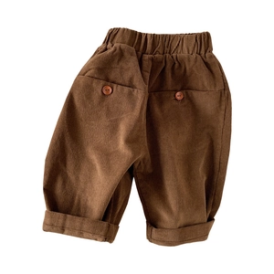 Kids corduroy loose pants in brown with elastic waist and buttoned back pockets