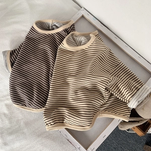 Detailed close-up of ribbed crewneck and high-quality cotton knit striped kid's tee