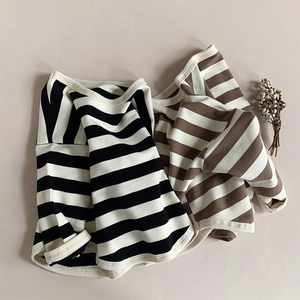 Detail of striped cotton rib knit shirts in black, white, and brown colors