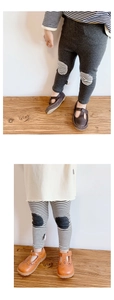 Close-up of cotton knit leggings with contrasting round knee patches for toddlers