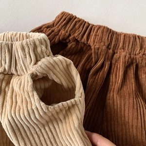 Detail of high-elastic waist and corduroy texture on girls' wide-leg casual pants