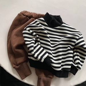 Kids warm striped fleece sweatshirt set with dark brown pants in minimalist flat lay