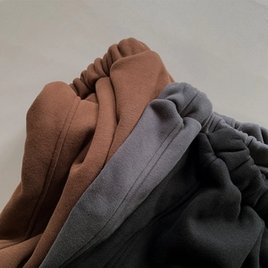 Fleece-lined kids joggers in brown and grey featuring elastic waistband for winter warmth