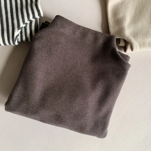Detailed texture of soft thermal fleece undershirts for kids in multi-color pile