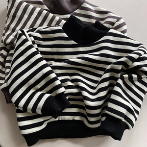 Detailed view of fleece striped sweatshirts with ribbed cuffs and crew neck collar