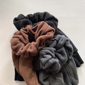 Detail shot of winter fleece-lined trousers showing soft interior texture in multiple colors