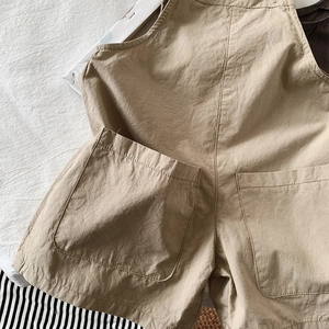 Kids khaki cotton breathable overalls with large front pockets and natural texture