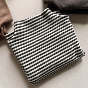 Detailed close-up of soft thick striped thermal shirt for kids with high texture finish