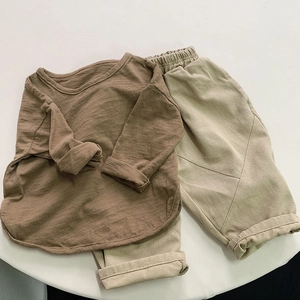 Detail view of cotton two-piece set featuring elastic waistband and soft textured fabric