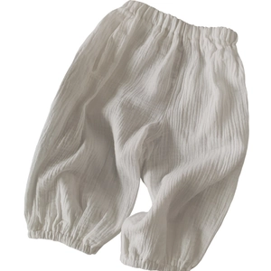 Pantalon blanc en gaze de coton pour bébé avec taille élastique et coupe ample