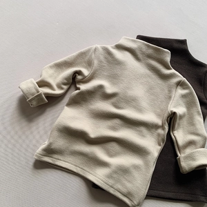 Detailed macro view of soft brushed velvet fabric on thermal long sleeve kids tops