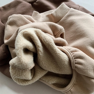Close-up of thick fleece lining and ribbed cuffs on kids warm pullover sweatshirts