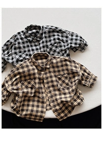 Flat lay of kids long sleeve shirts in black and brown plaid cotton fabric