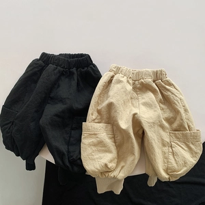 Set of two children's cotton harem pants in black and beige with side pockets