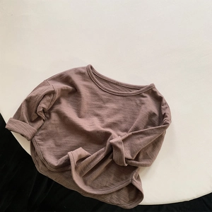 Detailed flat lay of long-sleeve kids T-shirt in coffee slub cotton with side slits