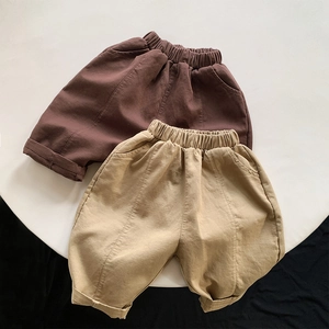 Detail of kids cotton loose harem pants with elastic waistband and decorative seams