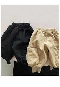Detail view of cotton kids cargo pants with elastic waist and large side pockets