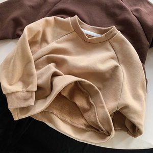 Detail view of khaki fleece lining and ribbed cuffs on kids' casual sports sweatshirt