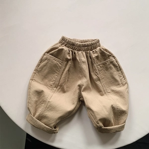 Flat lay of khaki cotton kids leisure pants with elastic waist and cuffed hems