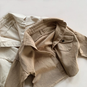 Detailed texture of cotton twill shirts in beige and khaki with front pocket