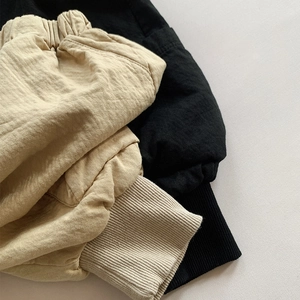 Detail of elastic waist and ribbed cuffs on kids double-layer cotton cargo joggers