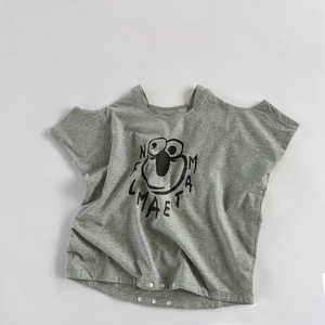 Close-up of baby gray cotton romper featuring soft knit texture and three white bottom snaps