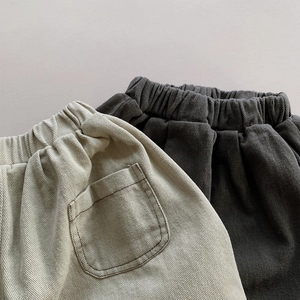 Detail view of elastic waist and back pocket on toddler corduroy harem pants
