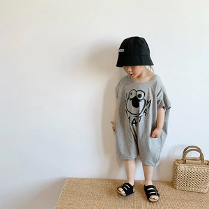 Detail of grey cotton girl's romper featuring a cute cartoon eye print and MAMA text