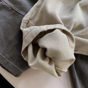 Detail of reinforced double-needle stitching and cuffed hems on toddler cotton harem pants