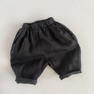 Detailed view of kids breathable linen shorts with elastic waist and cuffed leg hems