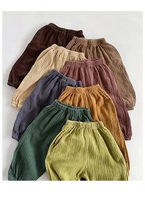 Flat lay of bamboo cotton kids harem pants showing multiple natural earthy colors and texture