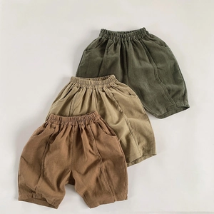 Three pairs of kids cotton linen shorts in earth tones with elastic waist and loose fit