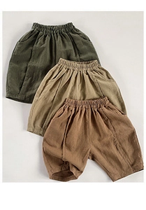 Close-up of kids cotton linen shorts with elastic waist and side pockets in three colors