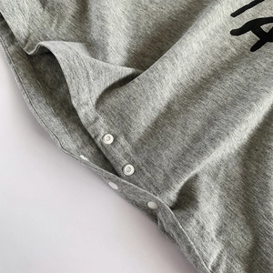 Soft heather gray cotton baby romper featuring secure resin snap buttons for comfort