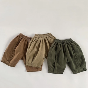 Detail of three colors of breathable linen kids' shorts with elastic waist and seams