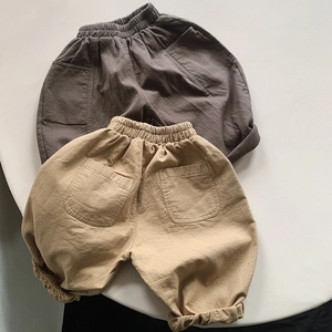 Detailed texture of cotton fabric and elastic waistband on casual kids' trousers