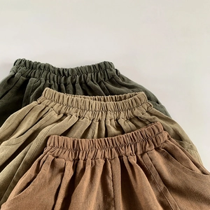 Detail view of linen-cotton kids shorts showing elastic waist and breathable fabric texture