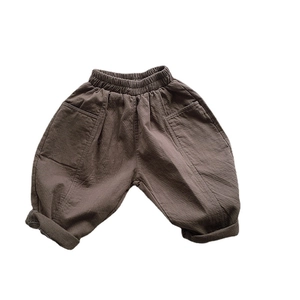 Kids' loose cotton casual trousers in dark brown with elastic waist and cargo style seam