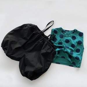 Kids cotton set featuring a green polka dot sleeveless top and black balloon harem pants