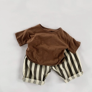 Kids minimalist summer set featuring brown cotton t-shirt and striped casual shorts