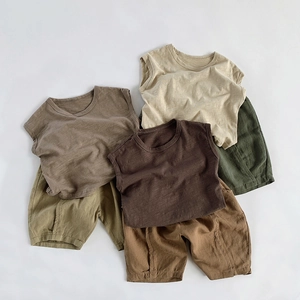 Detailed view of breathable cotton linen summer sets in various earthy colors for children