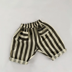 Detail of children's striped cotton pants with elastic waist and large front pockets