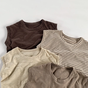 Flat lay of breathable slub cotton kids tank tops in neutral earth tones and stripes