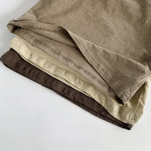 Close-up of slub cotton breathable tank top showing double-needle hem and texture