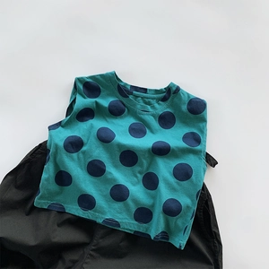 Detailed flat lay of a cotton polka dot tank top and loose pants set for kids