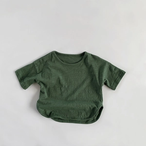 Detailed texture of dark green slub cotton kids' t-shirt with curved hem and crew neck